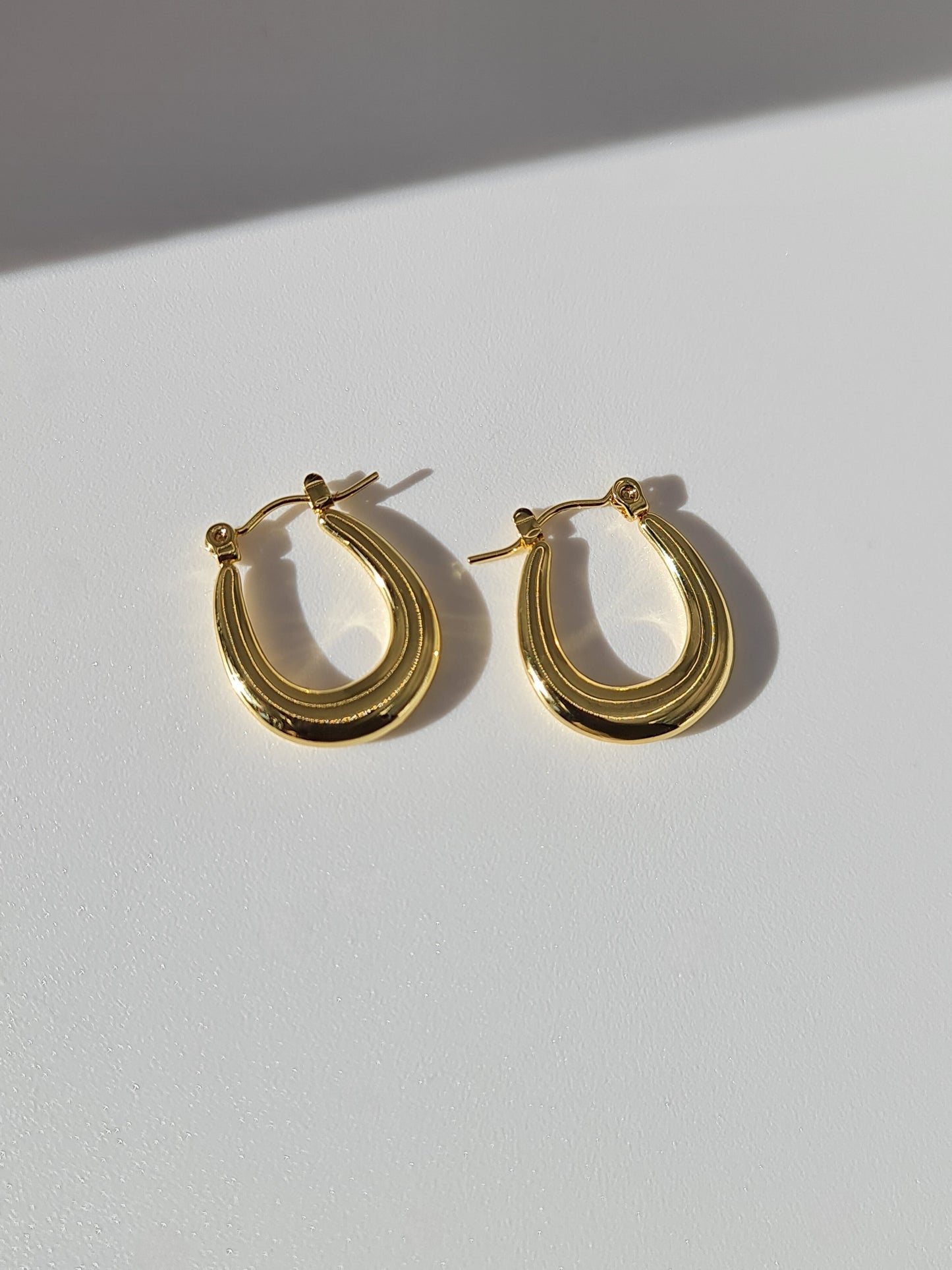 The Duke 18k Gold Plated Stainless Steel Oval Hoop Earrings.