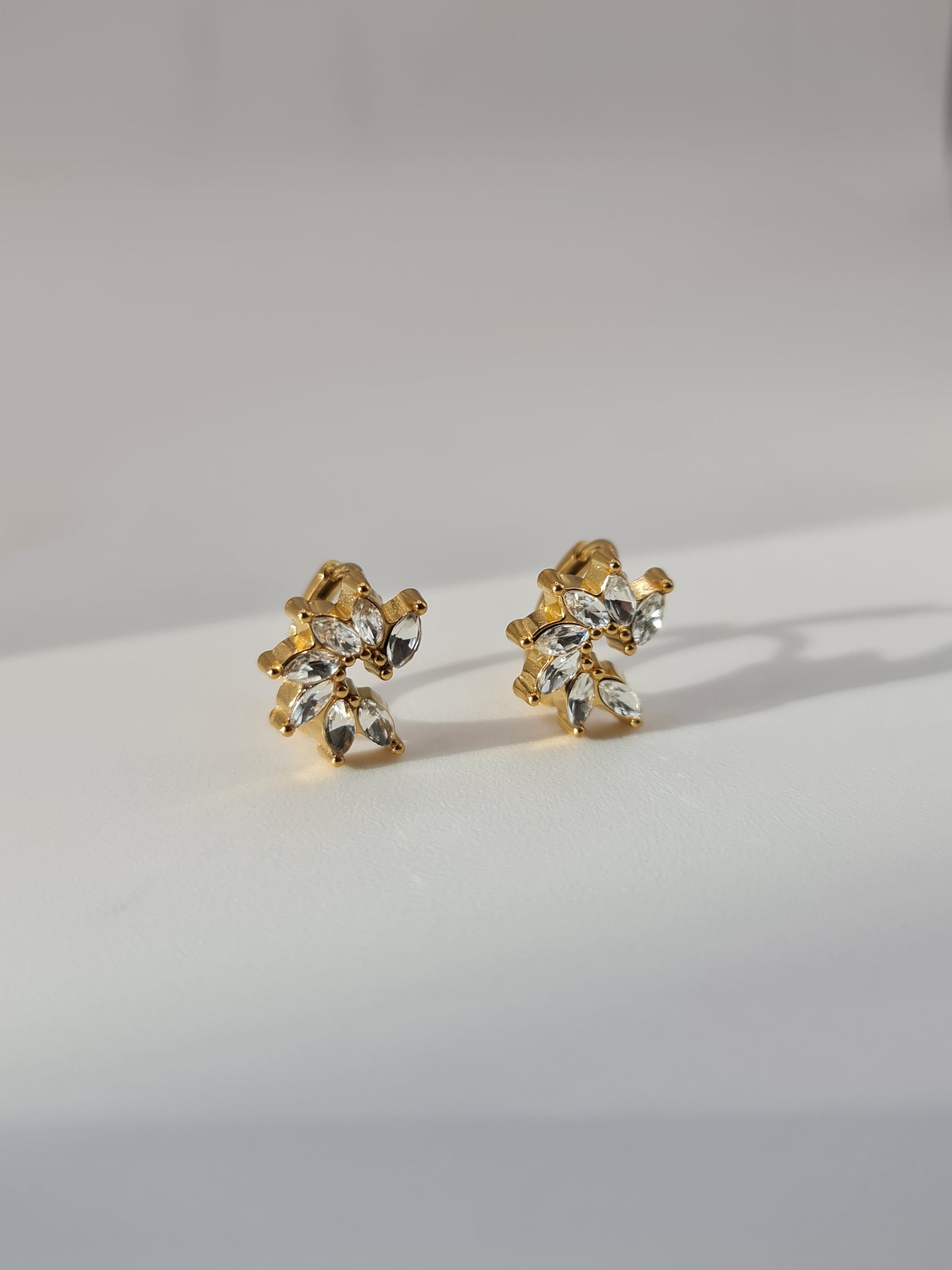 The Taylor 18k Gold Plated Stainless Steel Marquise Leaf Cut Cubic Zirconia Crystal Huggie Hoop Earrings.