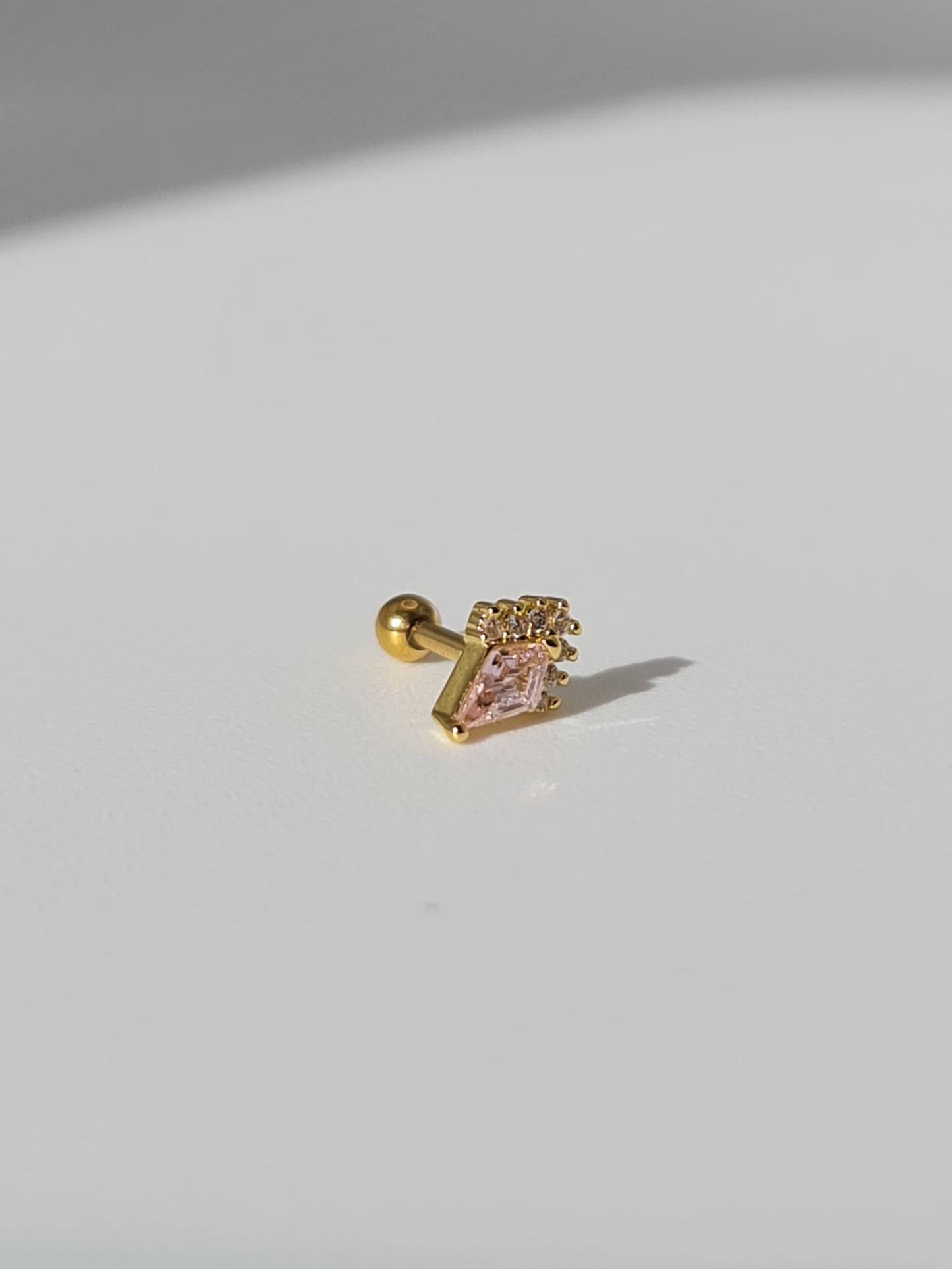 The Jordan 18k Gold Plated Titanium Steel Diamond Cut Crystal Dagger Cartilage Lobe Ball Back Stud Earring in Pink Cubic Zirconia.