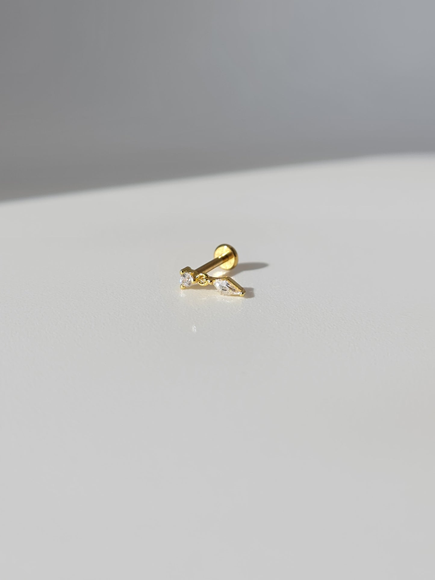 The Bailey 18k Gold Plated Stainless Steel Cubic Zirconia Crystal Drop Cartilage Lobe Flat Labret Stud Earring.