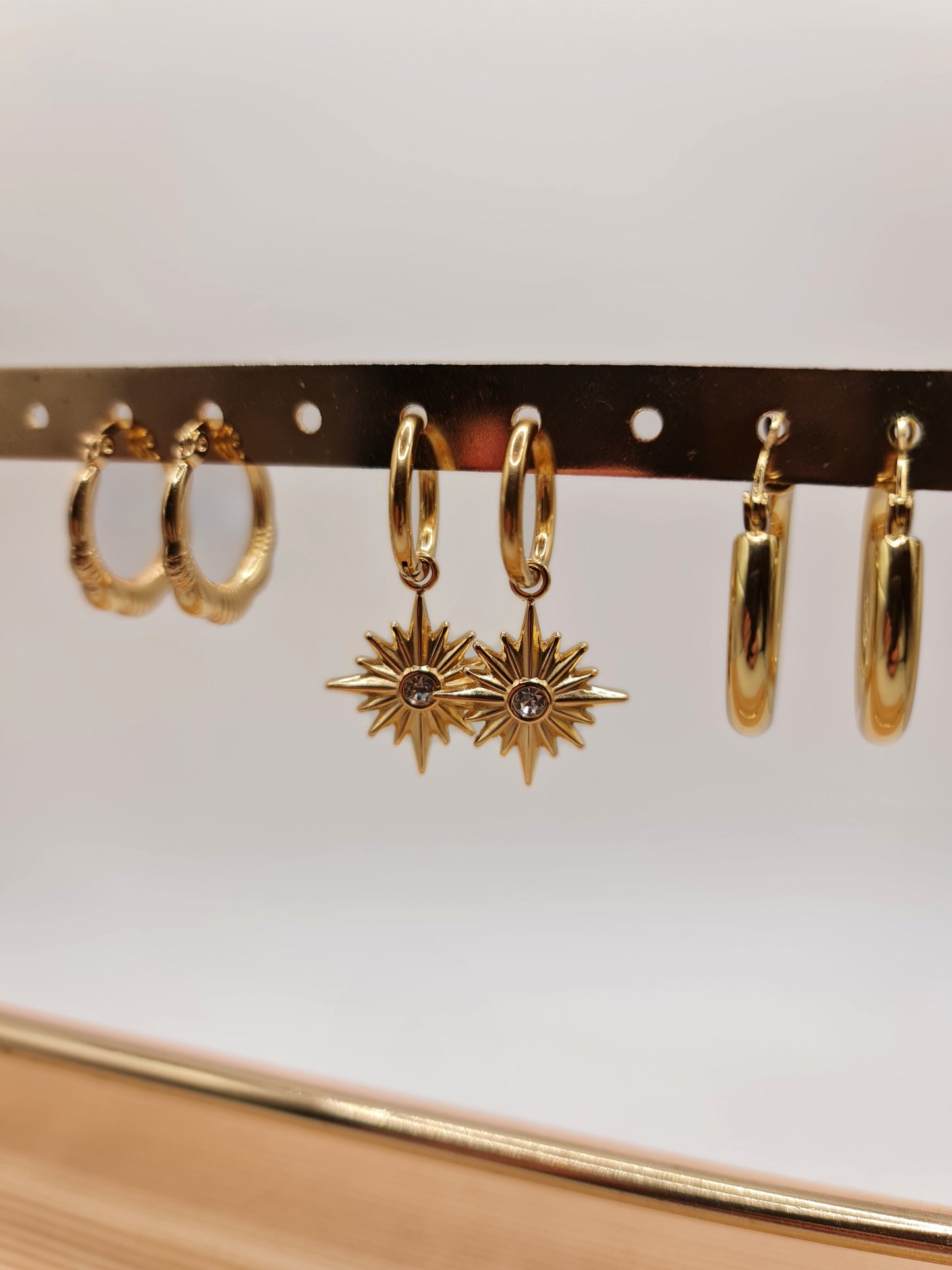 The Lexi 18k Gold Plated Stainless Steel Celestial Crystal Star Hoop Drop Earrings.