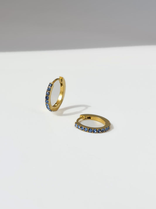 The Maija 'March' Aquamarine Birthstone 18k Gold Plated Stainless Steel Crystal Huggie Hoop Earrings.