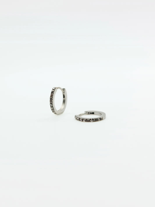 The Maija 'April' Diamond CZ Birthstone Silver Finish Tarnish Free Crystal Huggie Hoop Earrings.