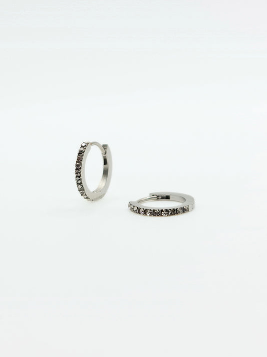 The Maija 'April' Diamond CZ Birthstone Silver Finish Tarnish Free Crystal Huggie Hoop Earrings.