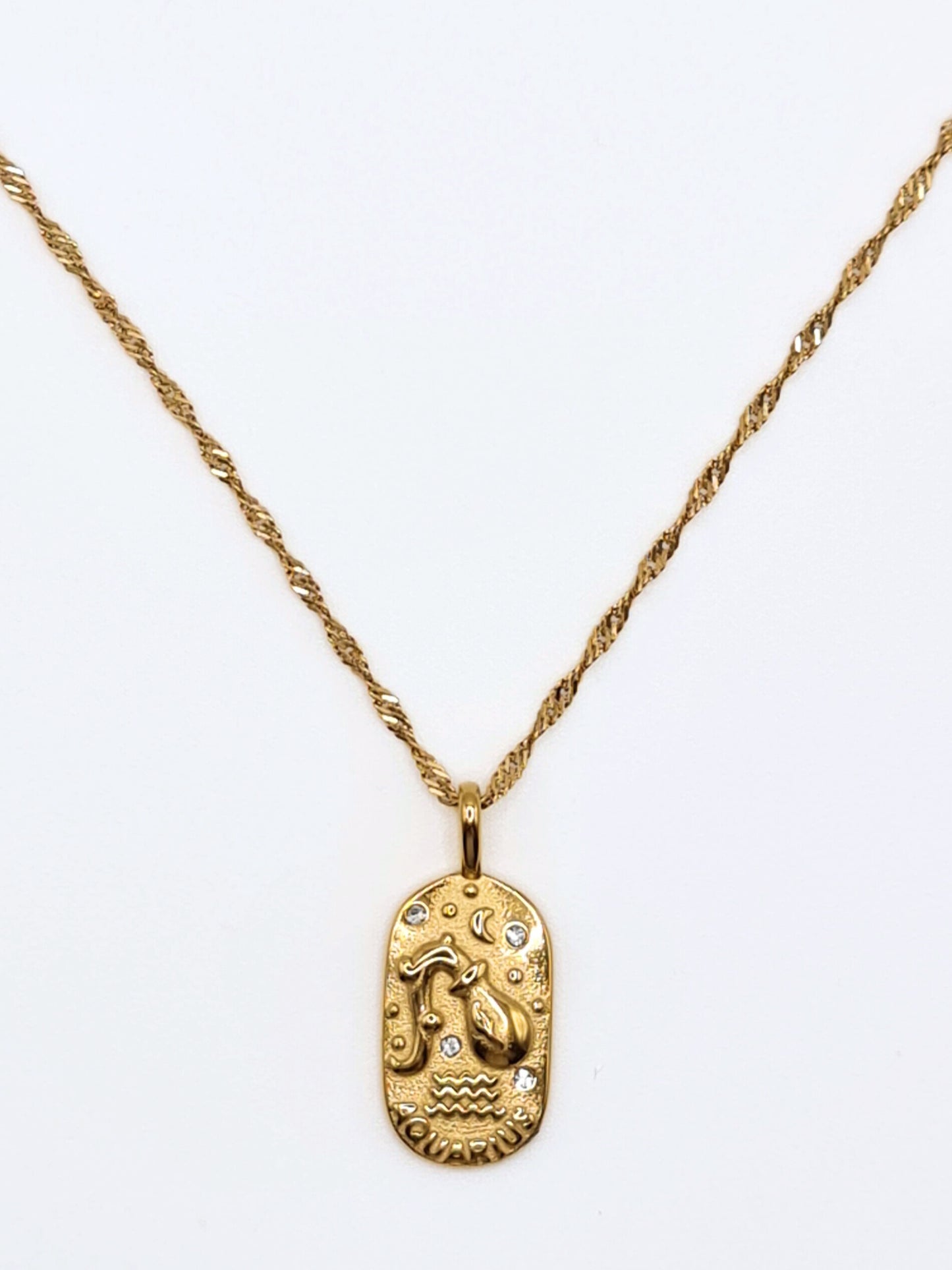 The Kiki Aquarius 18k Gold Plated Stainless Steel Zodiac Starsign Crystal Necklace.