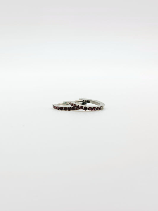 The Maija 'July' Ruby Birthstone Silver Finish Tarnish Free Crystal Huggie Hoop Earrings.