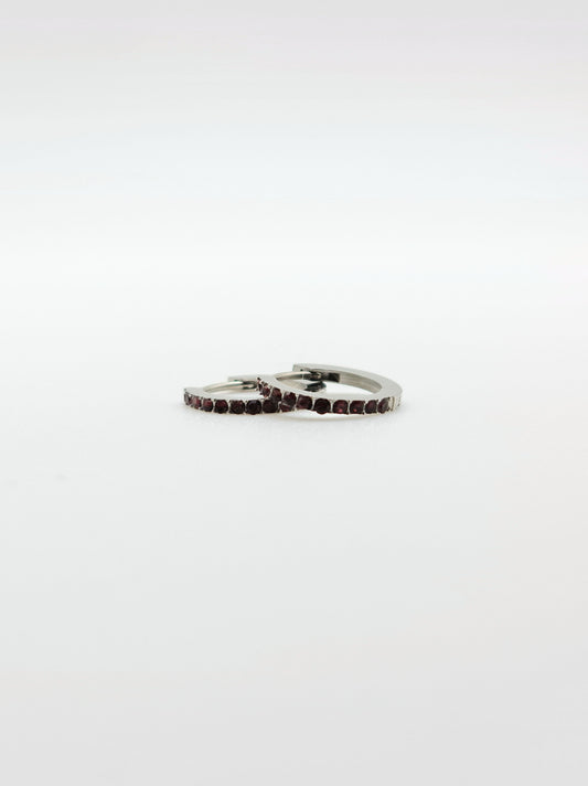 The Maija 'July' Ruby Birthstone Silver Finish Tarnish Free Crystal Huggie Hoop Earrings.