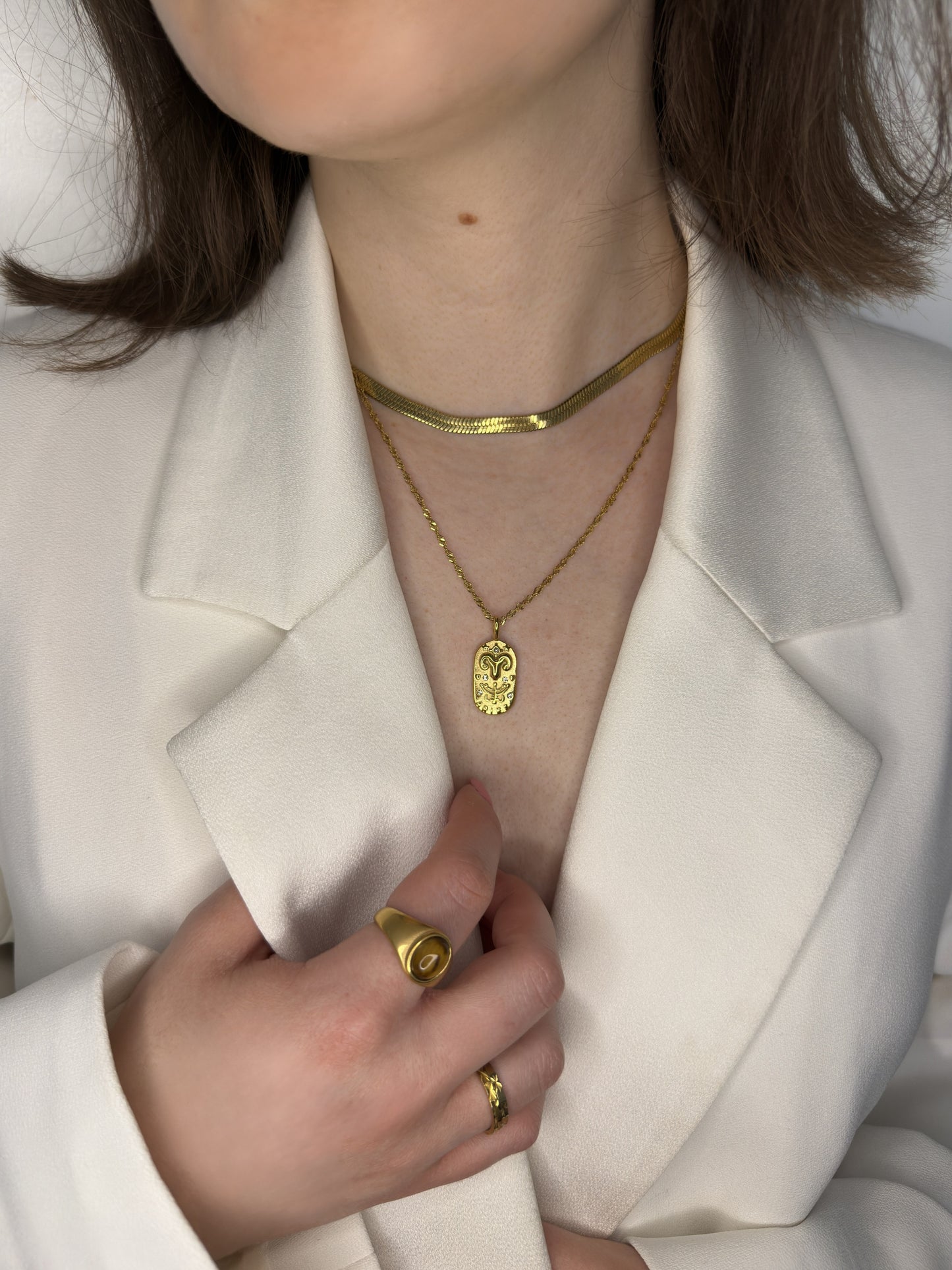 The Kiki Aries 18k Gold Plated Stainless Steel Zodiac Starsign Crystal Necklace.