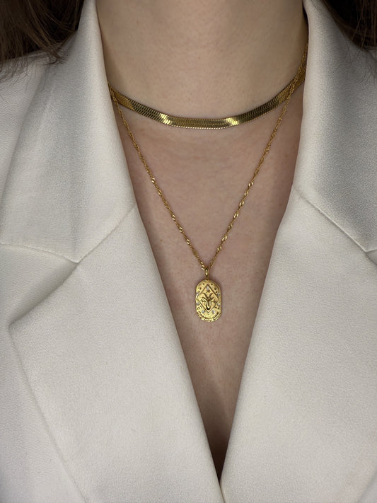 The Kiki Capricorn 18k Gold Plated Stainless Steel Zodiac Starsign Crystal Necklace.