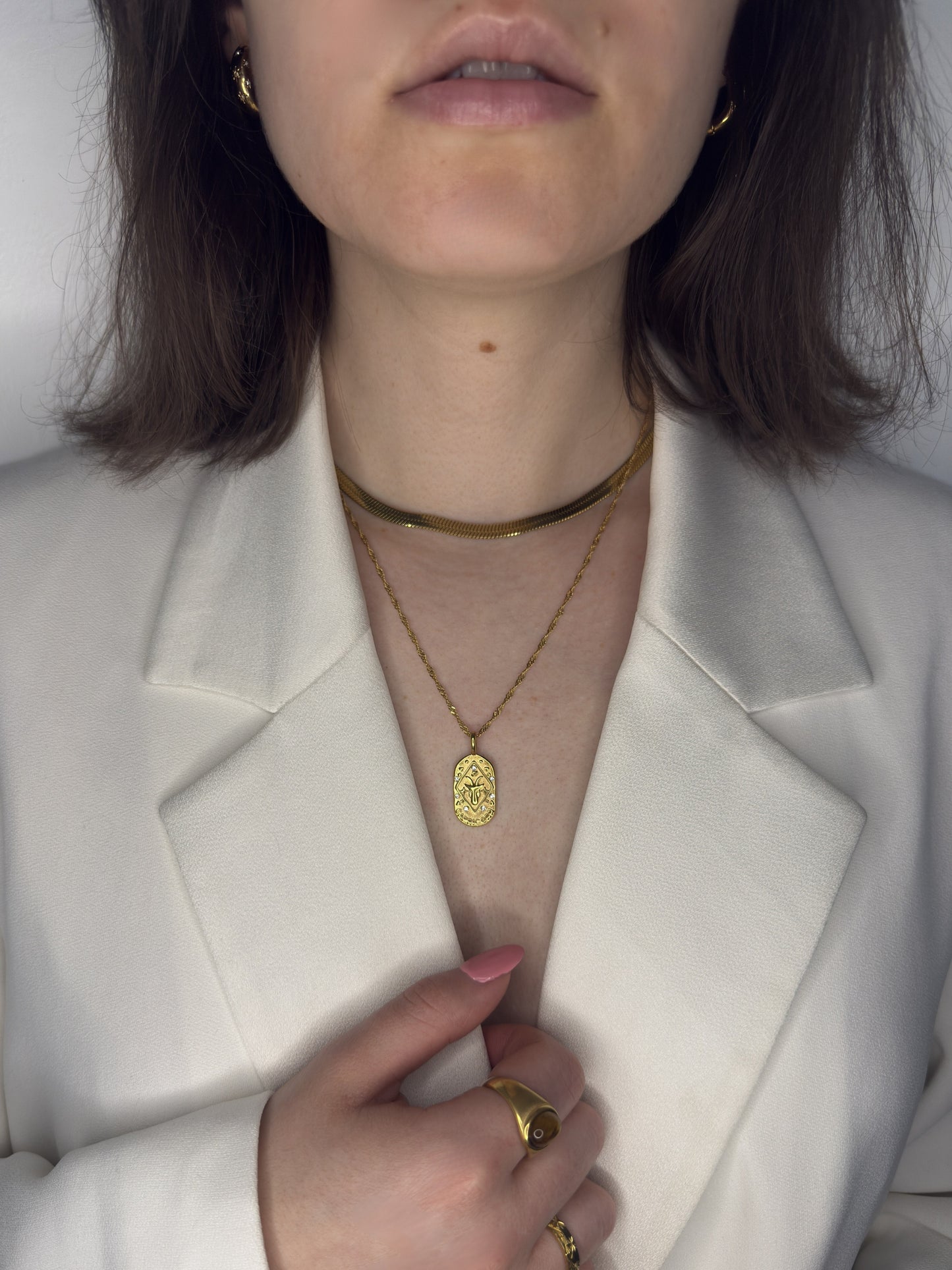 The Kiki Capricorn 18k Gold Plated Stainless Steel Zodiac Starsign Crystal Necklace.