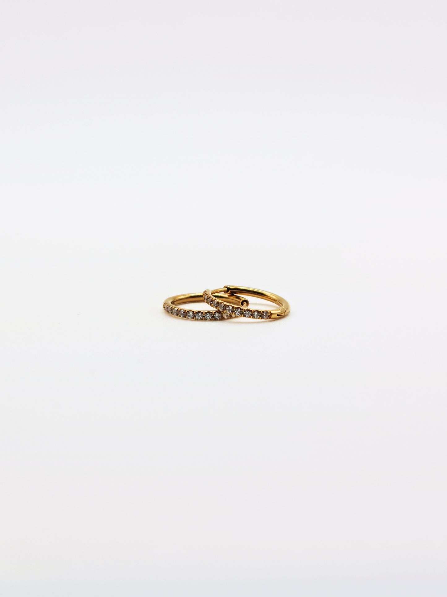 The Alaia Essentials 18k Gold Plated Tarnish-Free Crystal Pave Huggie Hoop Earrings in 12mm