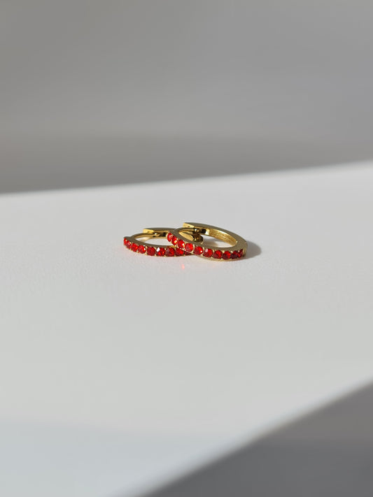 The Maija 'January' Garnet Birthstone 18k Gold Plated Stainless Steel Crystal Huggie Hoop Earrings.