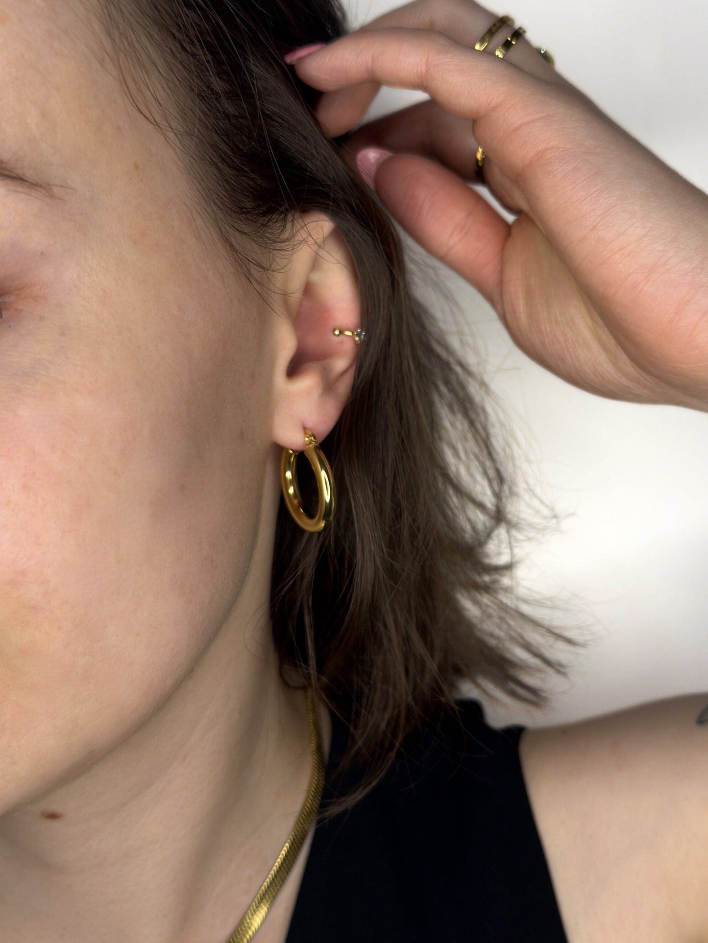 The Cassie 18k Gold Plated Stainless Steel Medium Hoop Earrings.