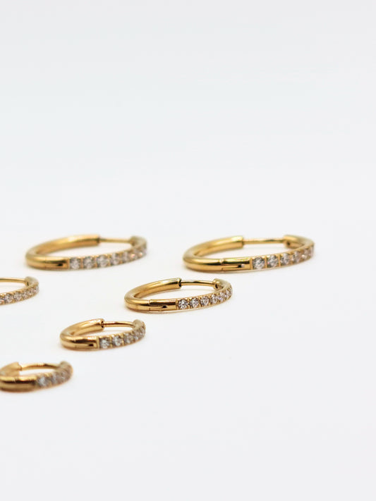 The Alaia Essentials 18k Gold Plated Tarnish-Free Crystal Pave Huggie Hoop Earrings in 12mm