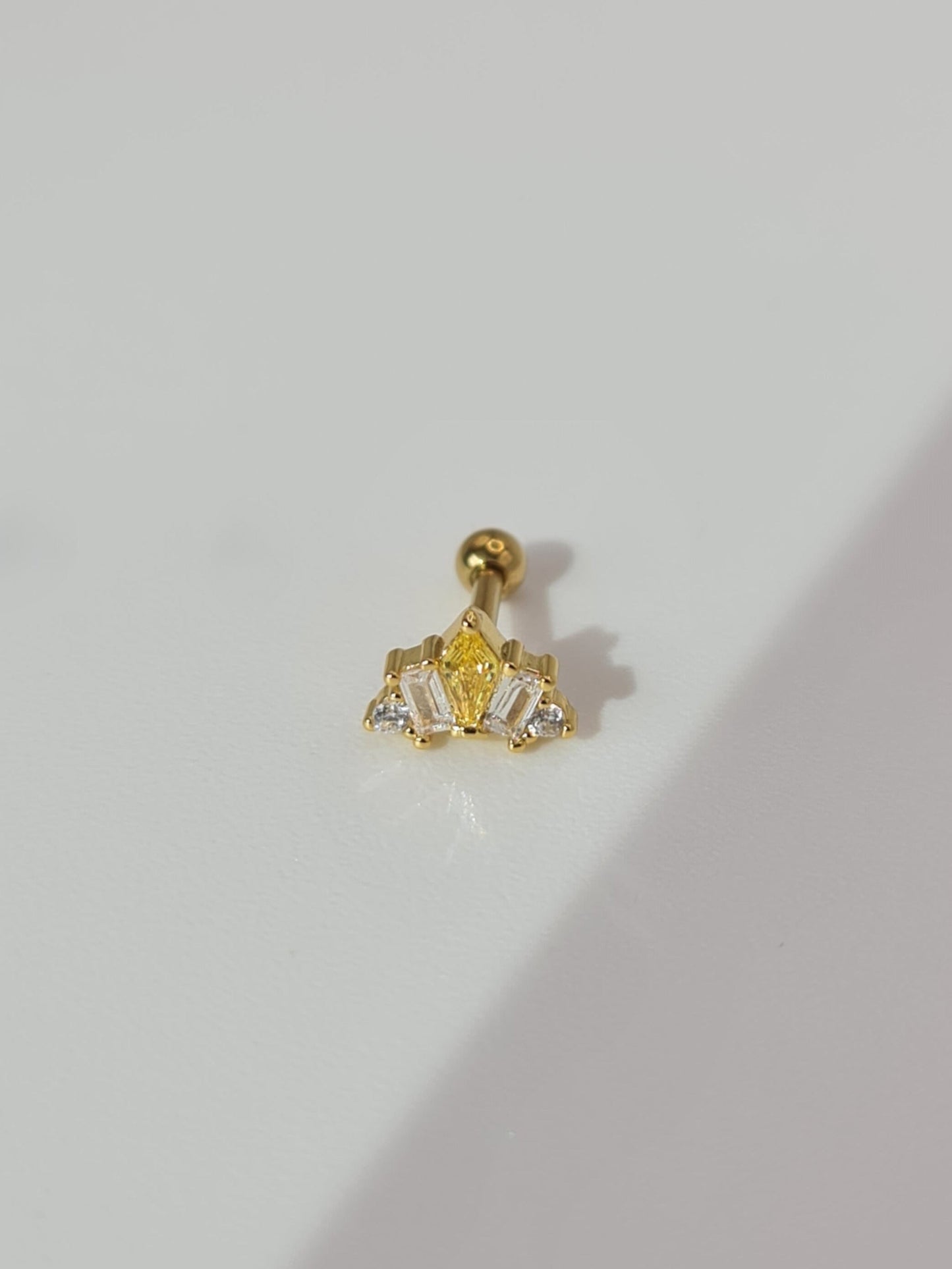The Frankie 18k Gold Plated Titanium Steel Mixed Cluster Cut Cubic Zirconia Cartilage Lobe Stud Earring in Yellow.