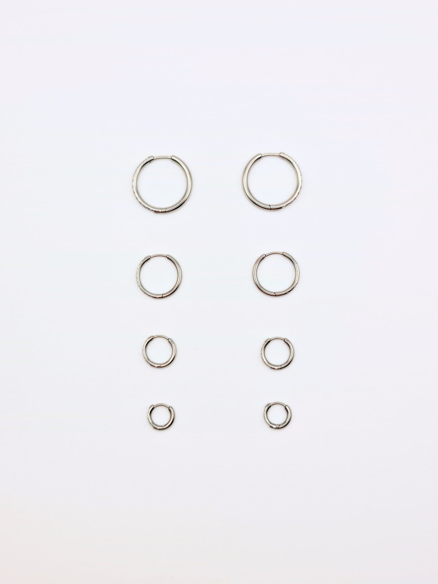 The Alaia Essentials Silver Finish Tarnish-Free Crystal Pave Huggie Hoop Earrings in 8mm