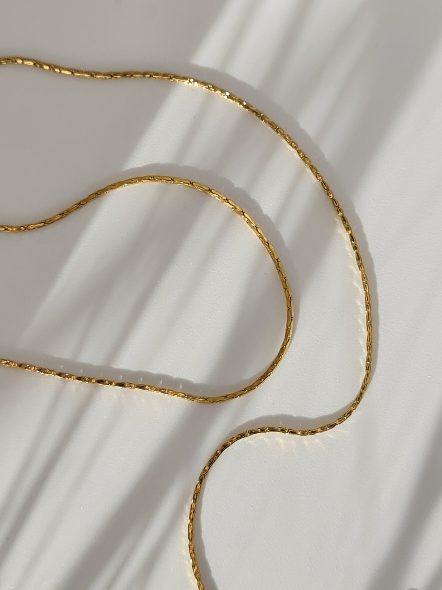 The Arizona 18k Gold Plated Stainless Steel Delicate Round Cobra Snake Chain Necklace.