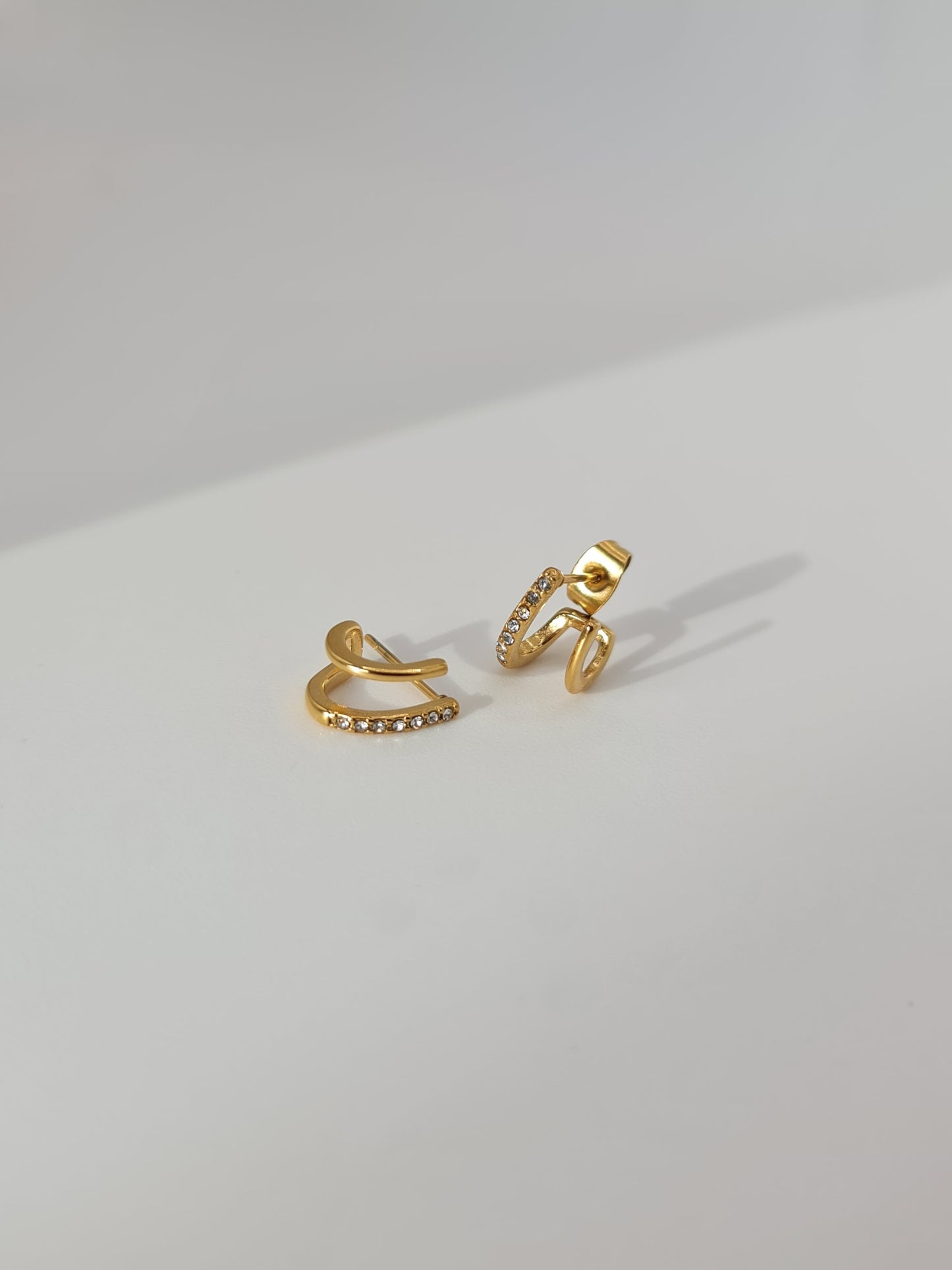 The Illusion 18k Gold Plated Stainless Steel Pave Crystal Double Hoop Earrings.