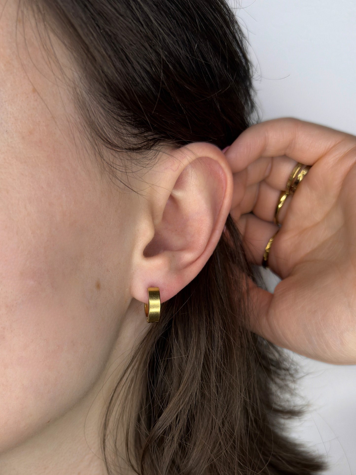 The Maddy 18k Gold Plated Stainless Steel Huggie Mini Hoop Earrings.