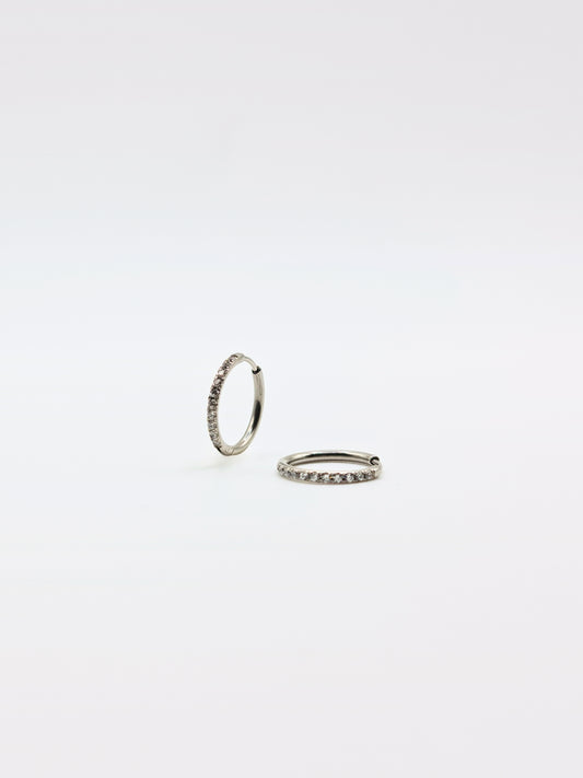 The Alaia Essentials Silver Finish Tarnish-Free Crystal Pave Huggie Hoop Earrings in 12mm