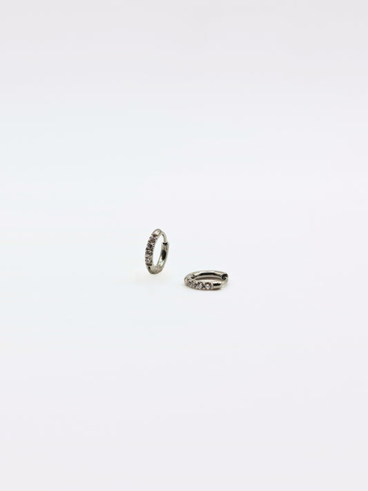 The Alaia Essentials Silver Finish Tarnish-Free Crystal Pave Huggie Hoop Earrings in 6mm