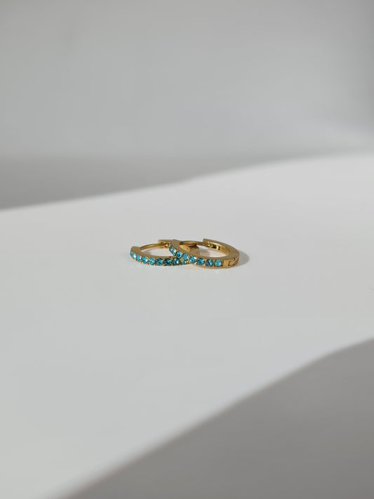The Maija 'December' Turquoise Birthstone 18k Gold Plated Stainless Steel Crystal Huggie Hoop Earrings.