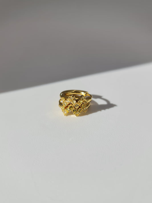 The Lumen 18k Gold Plated Stainless Steel Clustered Crystal Huggie Hoop Earrings in Citrine Yellow Cubic Zirconia.