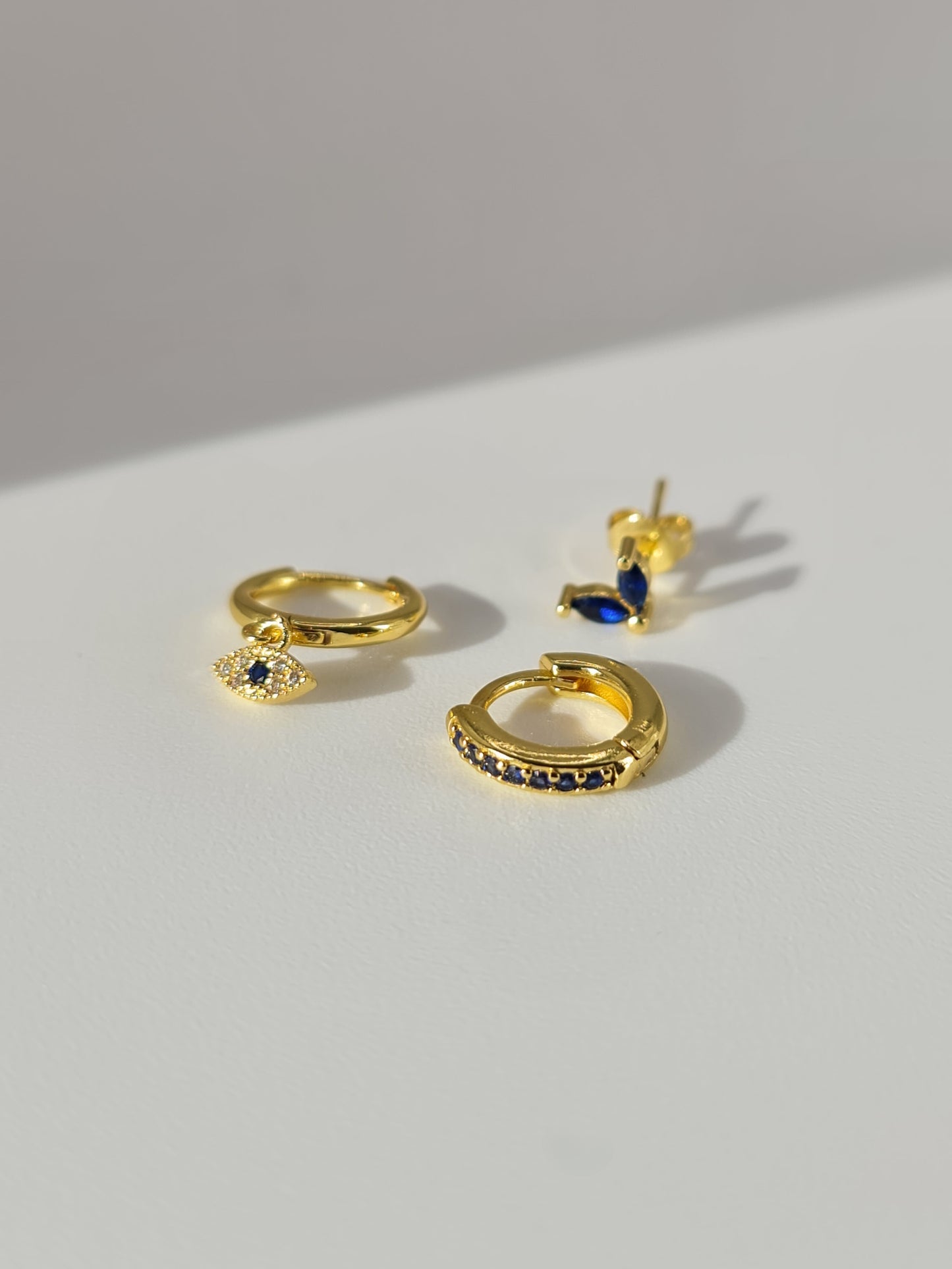 The Evil Eye 18k Gold Plated Stainless Steel Cubic Zirconia Matching Hoop and Stud 3pc Set.