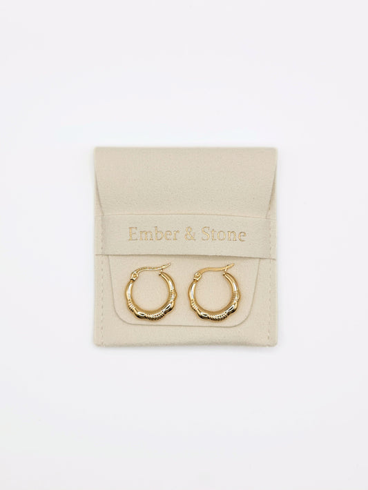 The Ashley 18k Gold Plated Stainless Steel Twist Etched Hoop Earrings.