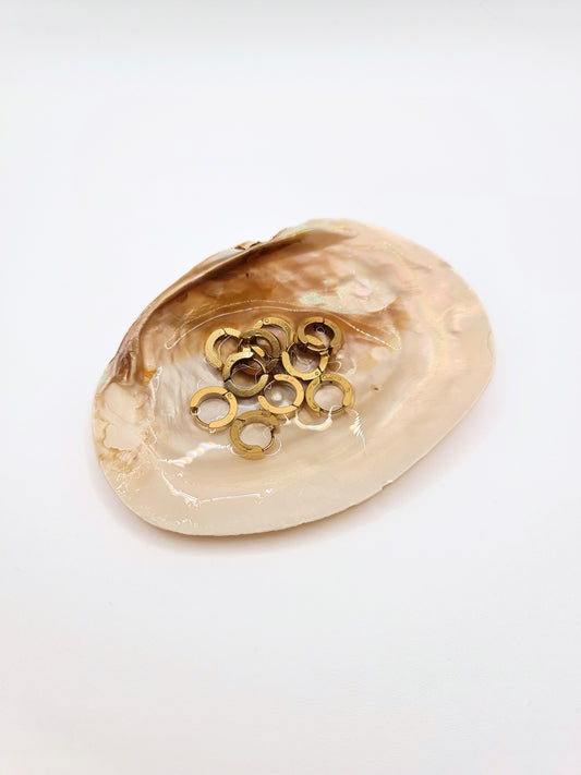 The Maddy Essentials 18k Gold Plated Stainless Steel Huggie Mini Hoop Earrings.