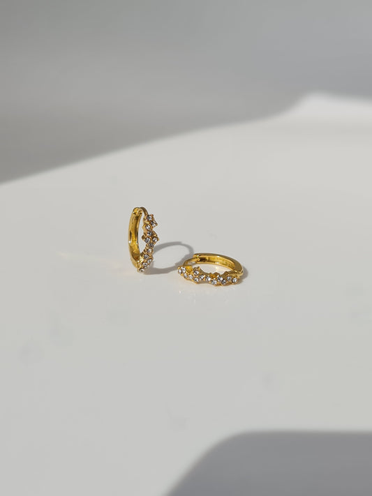 The Aurora 18k Gold Plated Stainless Steel Cubic Zirconia Pave Crystal Celestial Constellation Huggie Hoop Earrings.