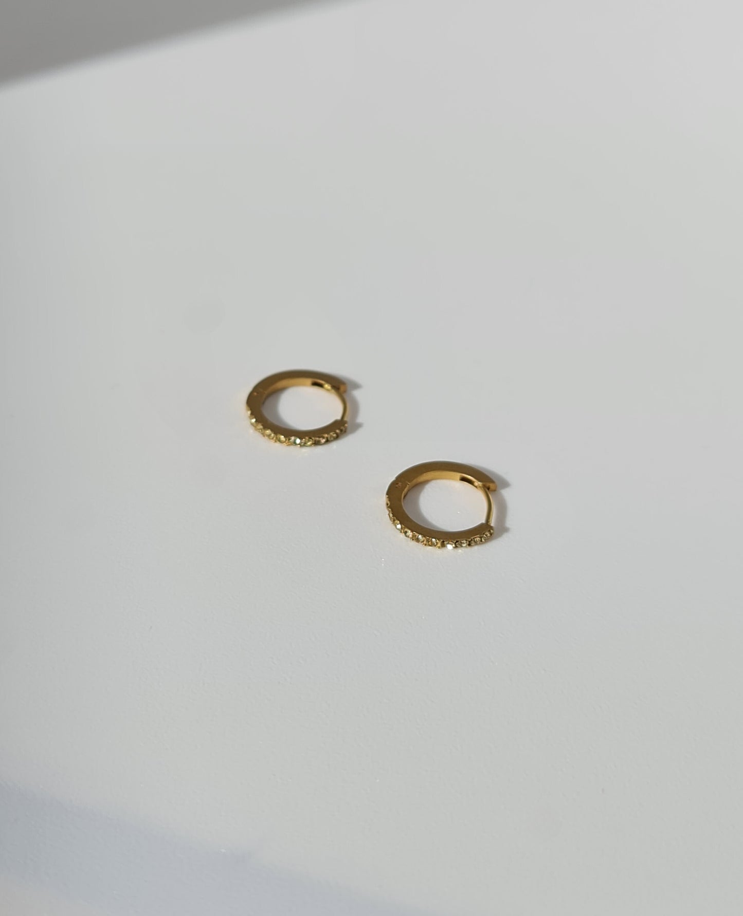 The Maija 'November' Citrine Birthstone 18k Gold Plated Stainless Steel Crystal Huggie Hoop Earrings.