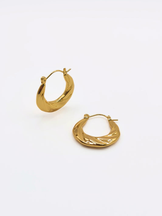The Anastasia 18k Gold Plated Stainless Steel Medium Twist Hoop Earrings.