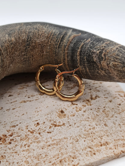 The Ashley 18k Gold Plated Stainless Steel Twist Etched Hoop Earrings.