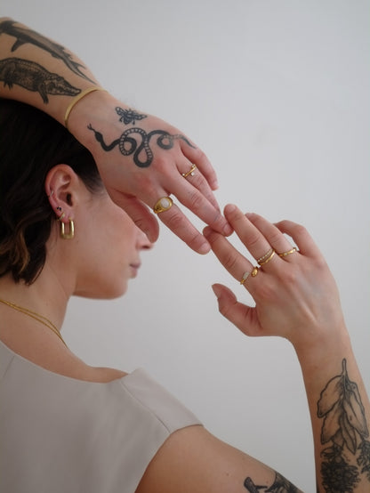 The Hope 18k Gold Plated Stainless Steel Crystal Celestial Wavy Ring.