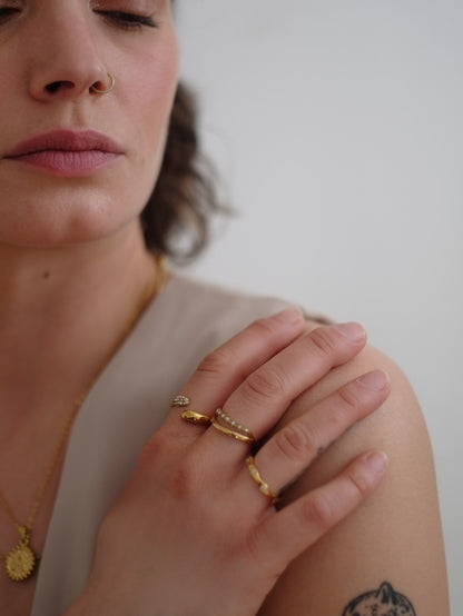 The Hope 18k Gold Plated Stainless Steel Crystal Celestial Wavy Ring.