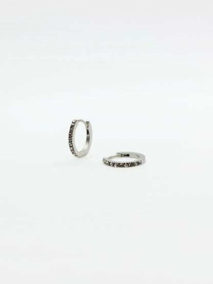 The Maija 'April' Diamond CZ Birthstone Silver Finish Tarnish Free Crystal Huggie Hoop Earrings.