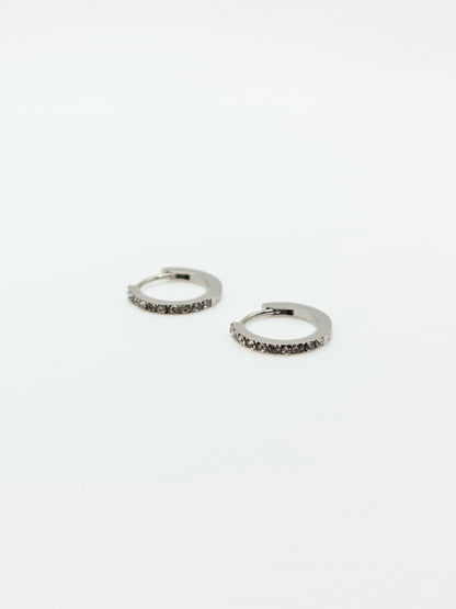 The Maija 'April' Diamond CZ Birthstone Silver Finish Tarnish Free Crystal Huggie Hoop Earrings.