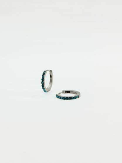 The Maija 'December' Turquoise Birthstone Silver Finish Tarnish Free Crystal Huggie Hoop Earrings.