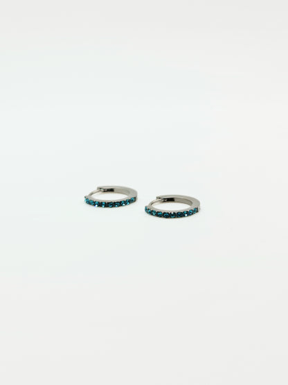 The Maija 'December' Turquoise Birthstone Silver Finish Tarnish Free Crystal Huggie Hoop Earrings.