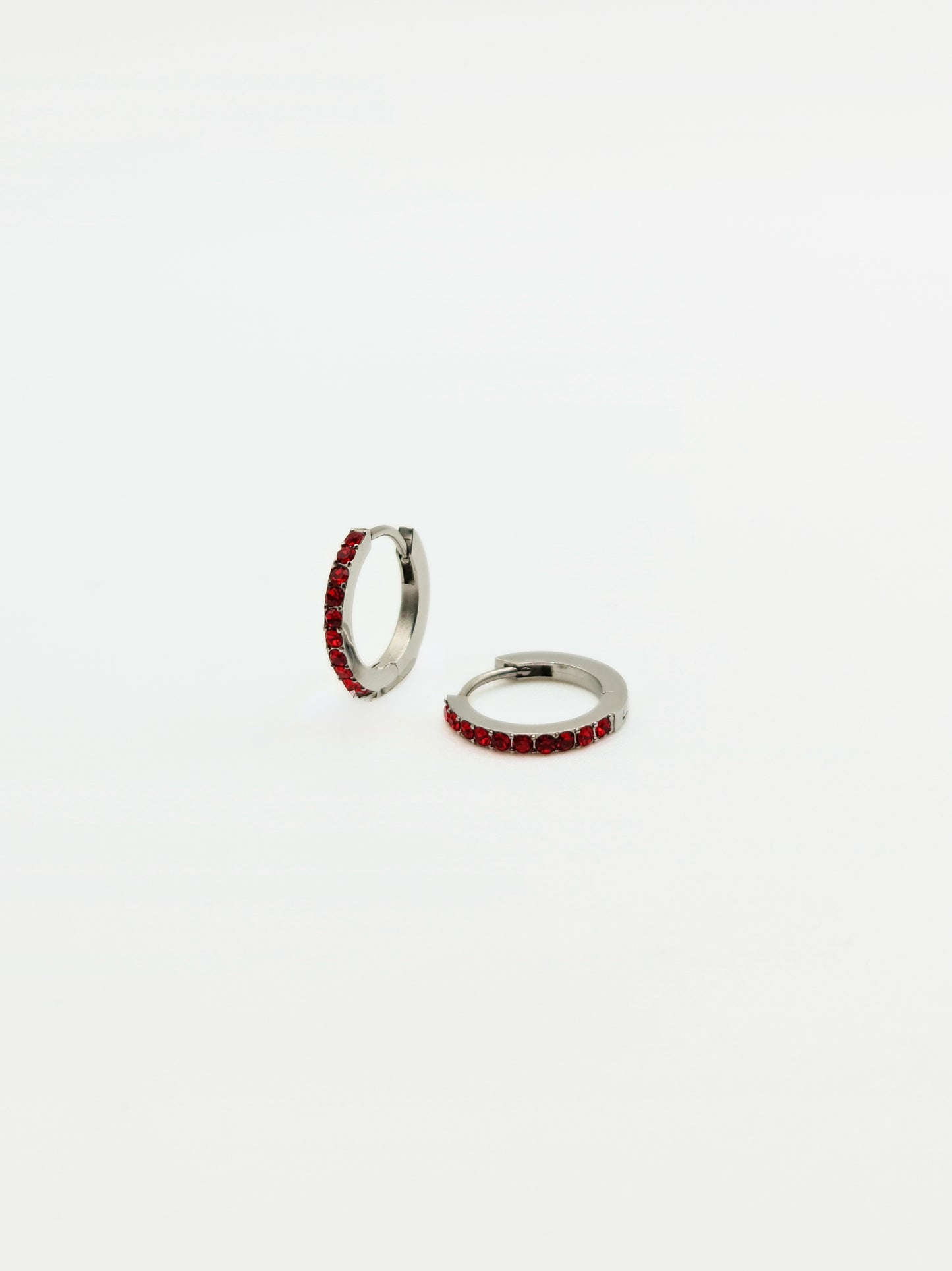 The Maija 'January' Garnet Birthstone Silver Finish Tarnish Free Crystal Huggie Hoop Earrings.