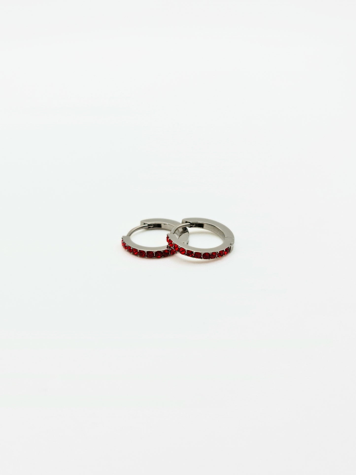 The Maija 'January' Garnet Birthstone Silver Finish Tarnish Free Crystal Huggie Hoop Earrings.