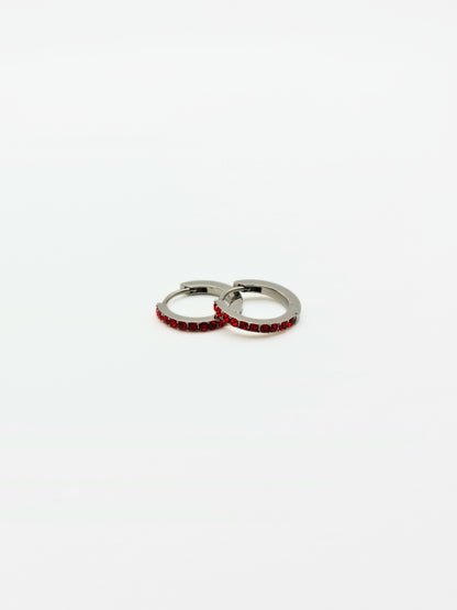 The Maija 'January' Garnet Birthstone Silver Finish Tarnish Free Crystal Huggie Hoop Earrings.