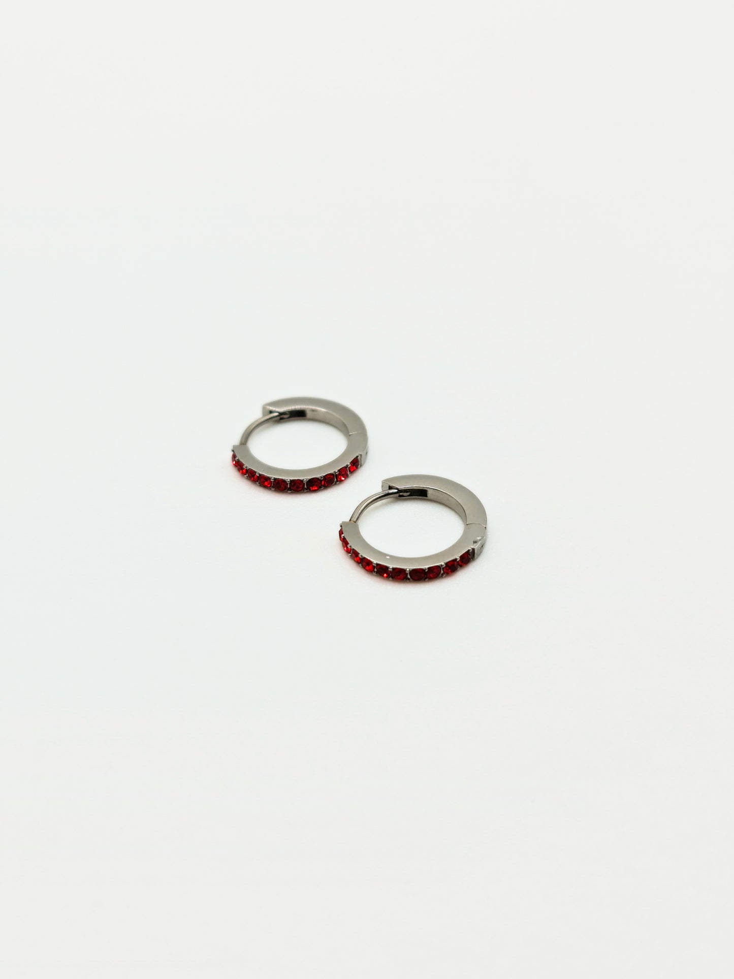 The Maija 'January' Garnet Birthstone Silver Finish Tarnish Free Crystal Huggie Hoop Earrings.