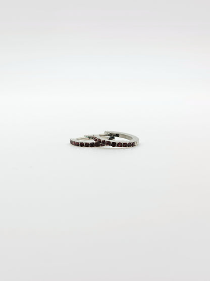 The Maija 'July' Ruby Birthstone Silver Finish Tarnish Free Crystal Huggie Hoop Earrings.