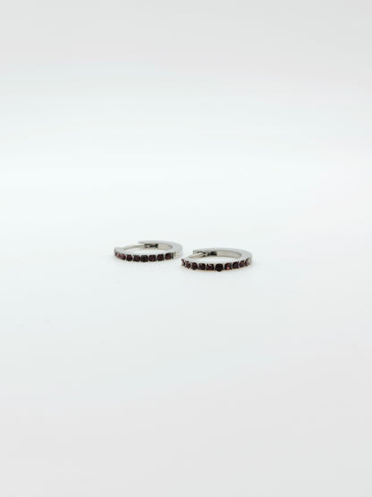 The Maija 'July' Ruby Birthstone Silver Finish Tarnish Free Crystal Huggie Hoop Earrings.