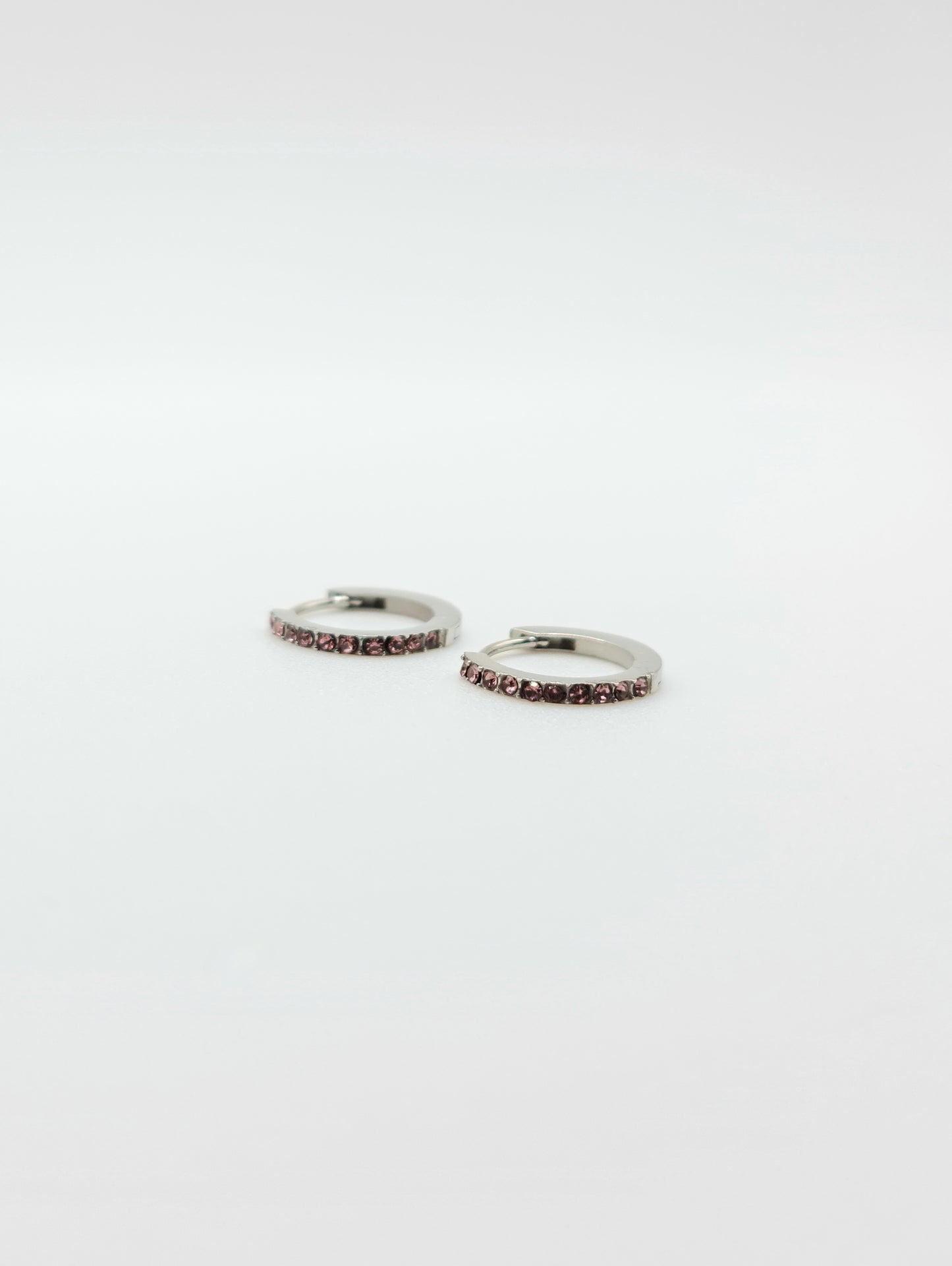 The Maija 'June' Alexandrite Birthstone Silver Finish Tarnish Free Crystal Huggie Hoop Earrings.