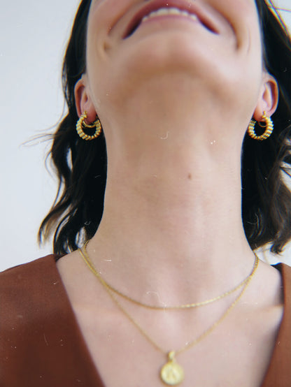 The Talisman Collection 18k Gold Plated Stainless Steel Beaded Hoop Earrings.