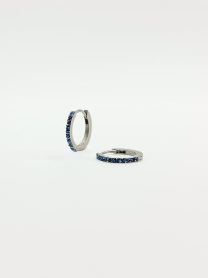 The Maija 'March' Aquamarine Birthstone Silver Finish Tarnish Free Crystal Huggie Hoop Earrings.