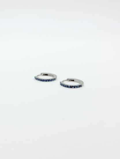 The Maija 'March' Aquamarine Birthstone Silver Finish Tarnish Free Crystal Huggie Hoop Earrings.